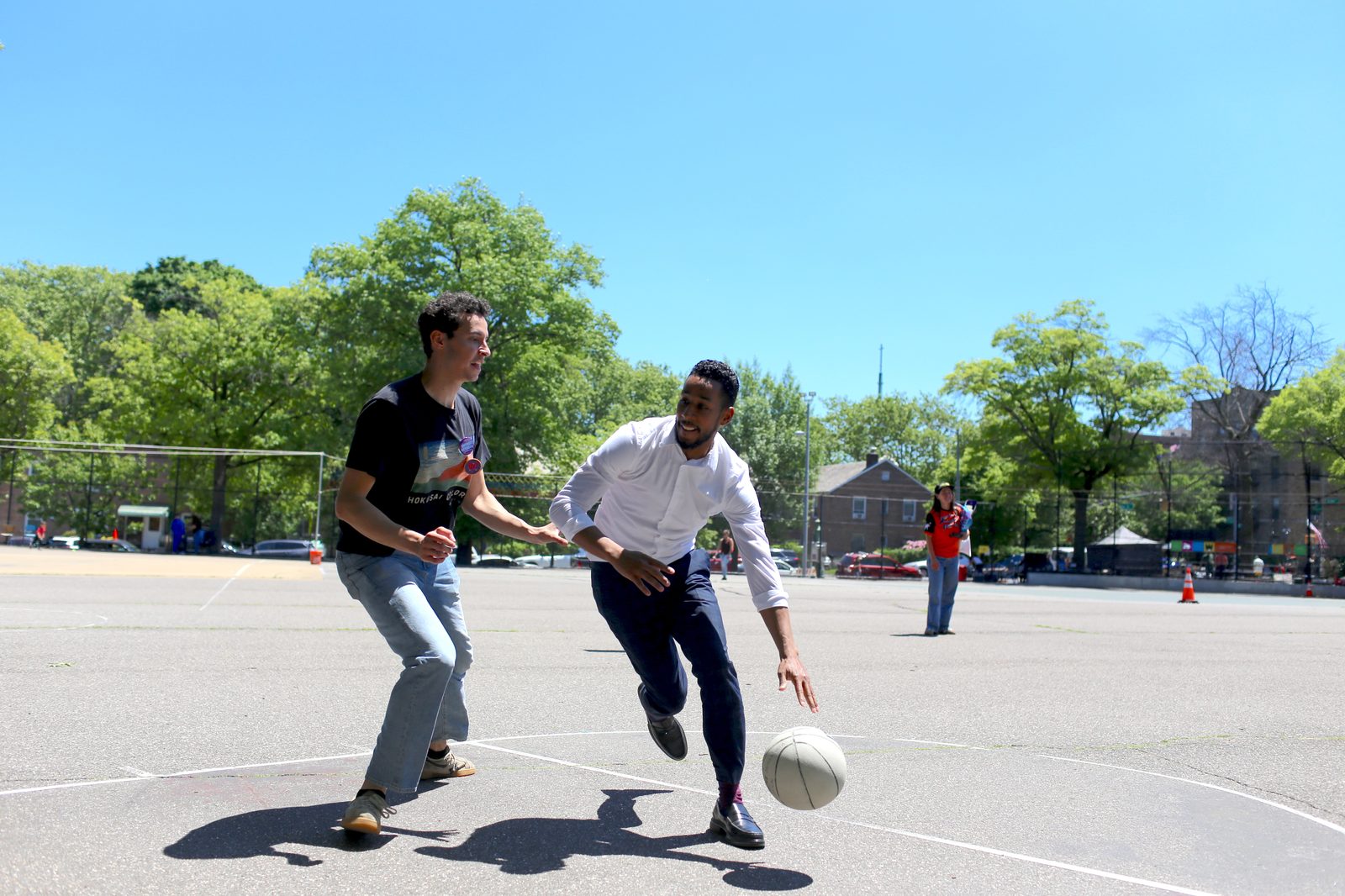 Antonio Reynoso playing basketball on a neighborhood court