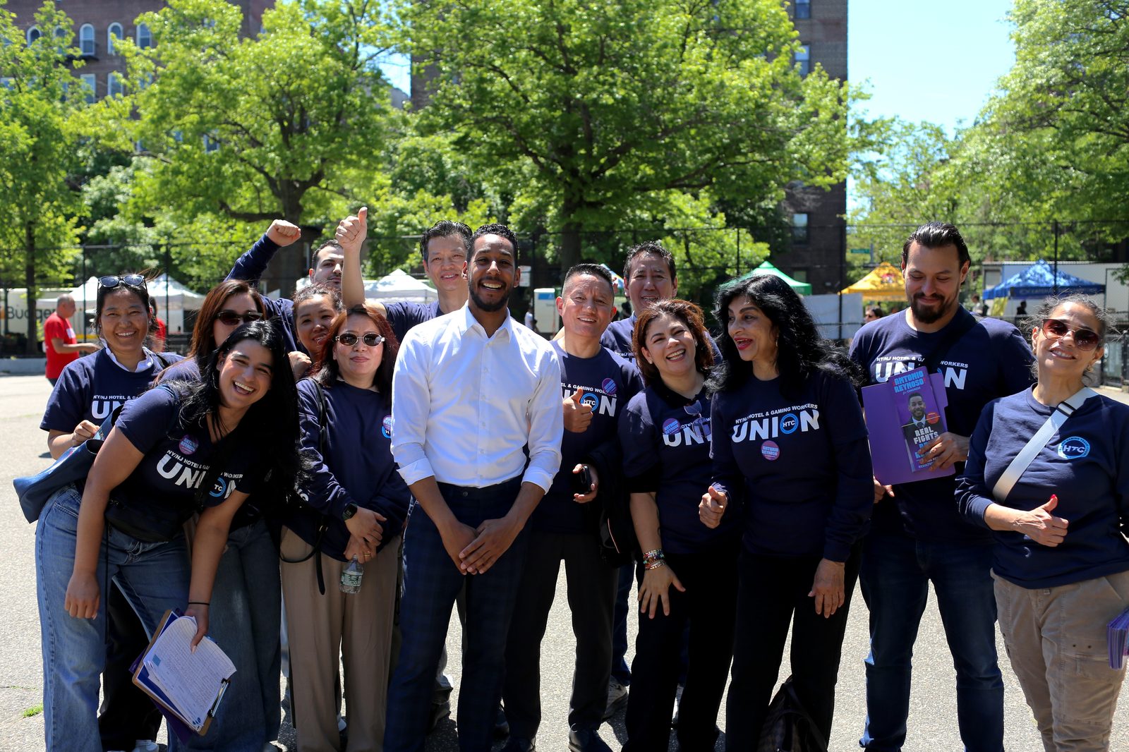 Antonio Reynoso smiling with a group of union volunteers in matching shirts